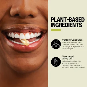 Person holding plant-based capsule in teeth.