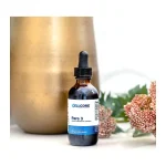 CellCore Para 3 tincture in a 59 mL amber dropper bottle beside dried flowers