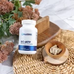 CellCore BC-ATP bottle beside capsules in a wooden bowl