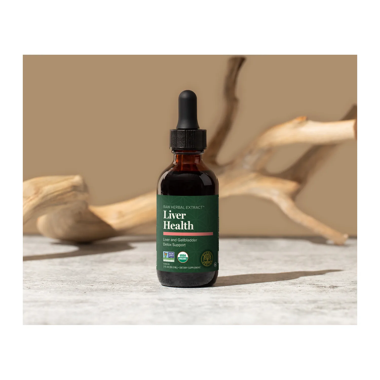 Global Healing Liver Health dropper bottle on a stone surface