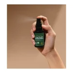 Global Healing Lung Health spray in use, misting from the bottle