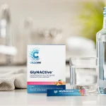 GlyNACtive box and peach mango stick pack next to a glass of water