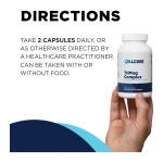 Hand holding a bottle of TriMag Complex with the directions: take 2 capsules daily, with or without food